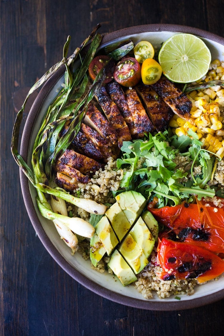 20 Healthy Summer Dinner Recipes! Healthy, Easy, Chipotle Grilled Chicken Salad with Grilled Corn, Peppers and Arugula, over a bed of optional quinoa with grilled scallions, avocado and a simple Chipotle Lime Dressing.  Sub MEXICAN TOFU for the Chicken for a vegan version! #chipotlechicken #mexicansalad #chickensalad #grilledchicken