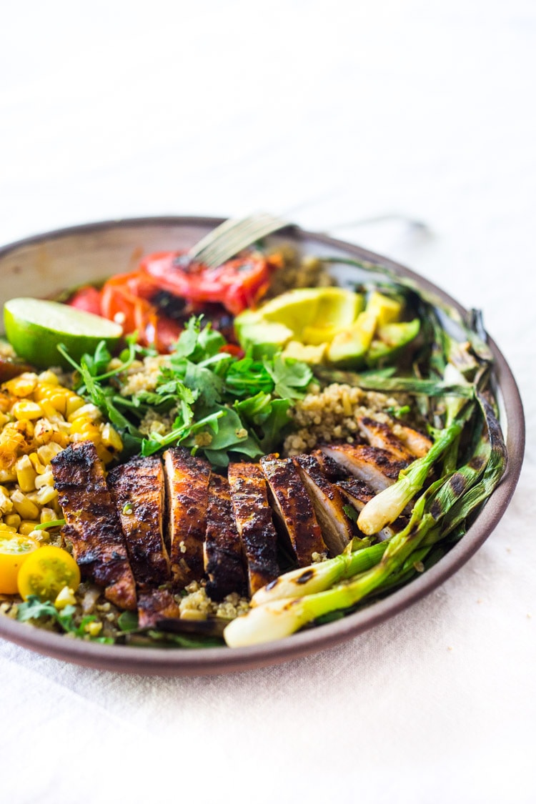 Healthy, Easy, Chipotle Grilled Chicken Salad with Grilled Corn, Peppers and Arugula, over a bed of optional quinoa with grilled scallions, avocado and a simple Chipotle Lime Dressing.  #chickensalad #grilledchickensalad #chipotle #salad #chicken #grilledchicken #quinoa #healthy #arugula