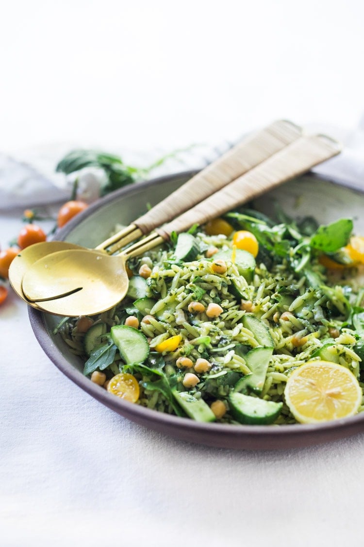 Lemon Basil Orzo Salad with cucumbers, tomatoes and arugula. A healthy, vegan pasta salad that can be made ahead for midweek lunches or potlucks. Keep it vegan or add feta! #orzo #orzosalad #orzopasta #pastasalad #vegan #orzorecipes