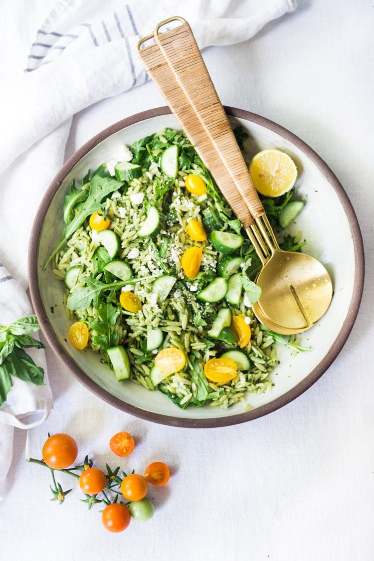 Lemon Basil Orzo Salad with cucumbers, tomatoes and arugula. A healthy, vegan pasta salad that can be made ahead for midweek lunches or potlucks. Keep it vegan or add feta! #orzo #orzosalad #orzopasta #pastasalad #vegan #orzorecipes