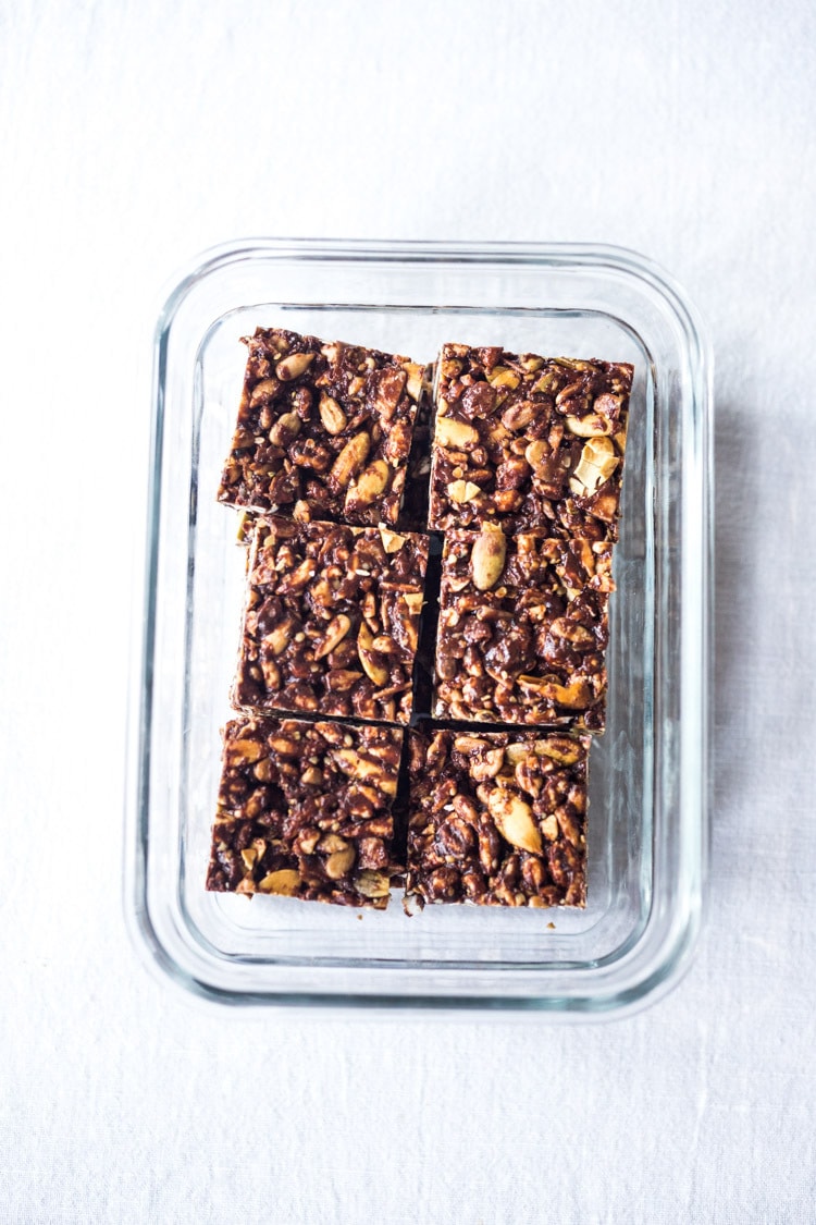 These healthy vegan Rice Crispy Treats are made with puffed 7-grain cereal, almond butter, ground cacao powder and a boatload of seeds- chia, sunflower and pumpkin. A delicious, VEGAN, chocolatey fix, full of nutritious ingredients.