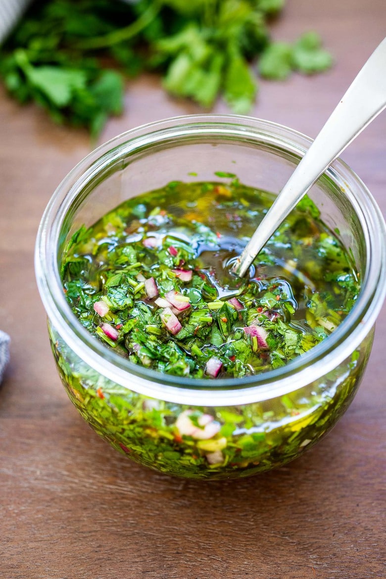 Chimichurri Sauce - a quick and easy Argentinian herb sauce that will quickly become your new favorite condiment that can be made in 10 minutes! #chimichurri 