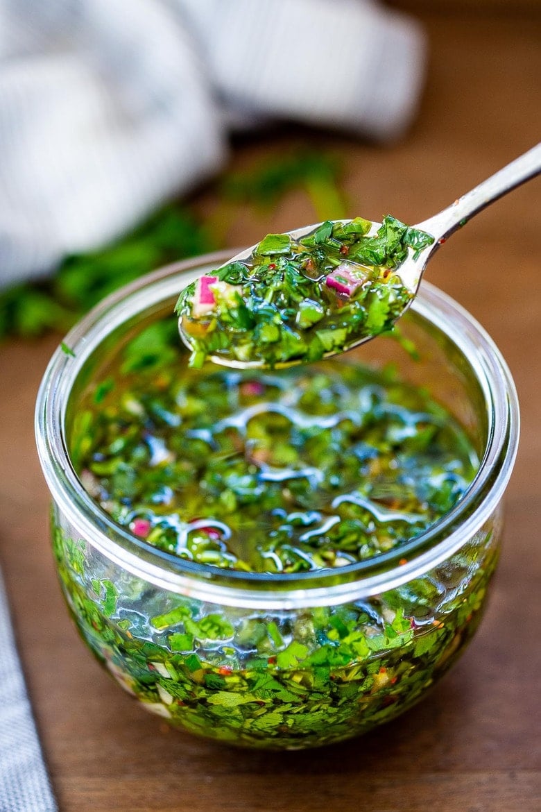 The Best Chimichurri Sauce recipe -an herby flavorful Argentinean condiment used on grilled meats and vegan dishes! 