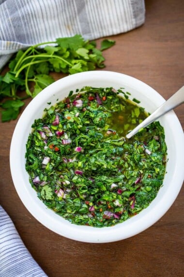The best Chimichurri Sauce - an herby green sauce from Argentina that will quickly become your new favorite condiment. Make it in 10 minutes!