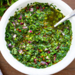 The best Chimichurri Sauce - an herby green sauce from Argentina that will quickly become your new favorite condiment. Make it in 10 minutes!