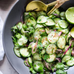 This easy Everyday Cucumber Salad with Chili and Lime pairs well with so many things!  Vegan, paleo and Gluten-free! Cool and refreshing, serve it alongside grilled fish or meat. Great for Sunday meal prep - make a big batch and tuck it into tacos, buddha bowls or simply spoon it over a bowl of nutty quinoa during the busy workweek. Or bring it to a potluck for a healthy side dish. A delicious, seasonal companion to just about everything! #cucumber #cucumbersalad #potluck #mealprep #easy #healthy #batchcooking #vegan #paleo #glutenfree #lowcarb #lowcalorie