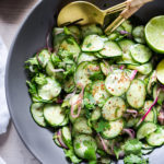 A delicious Cucumber Salad with fresh herbs, citrus, and red onion. Easy to make with the simplest ingredients- it's cool, crunchy, refreshing, and pairs with many things!