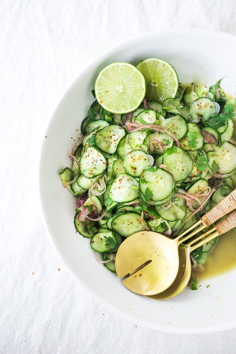 Cucumber Salad with Cilantro and Lime pairs well with so many things!  Vegan, paleo and Gluten-free! Cool and refreshing, serve it alongside grilled fish or meat. Great for Sunday meal prep! A delicious, seasonal companion to just about everything! #cucumber #cucumbersalad #potluck #mealprep #easy #healthy #batchcooking #vegan #paleo #glutenfree #lowcarb #lowcalorie 