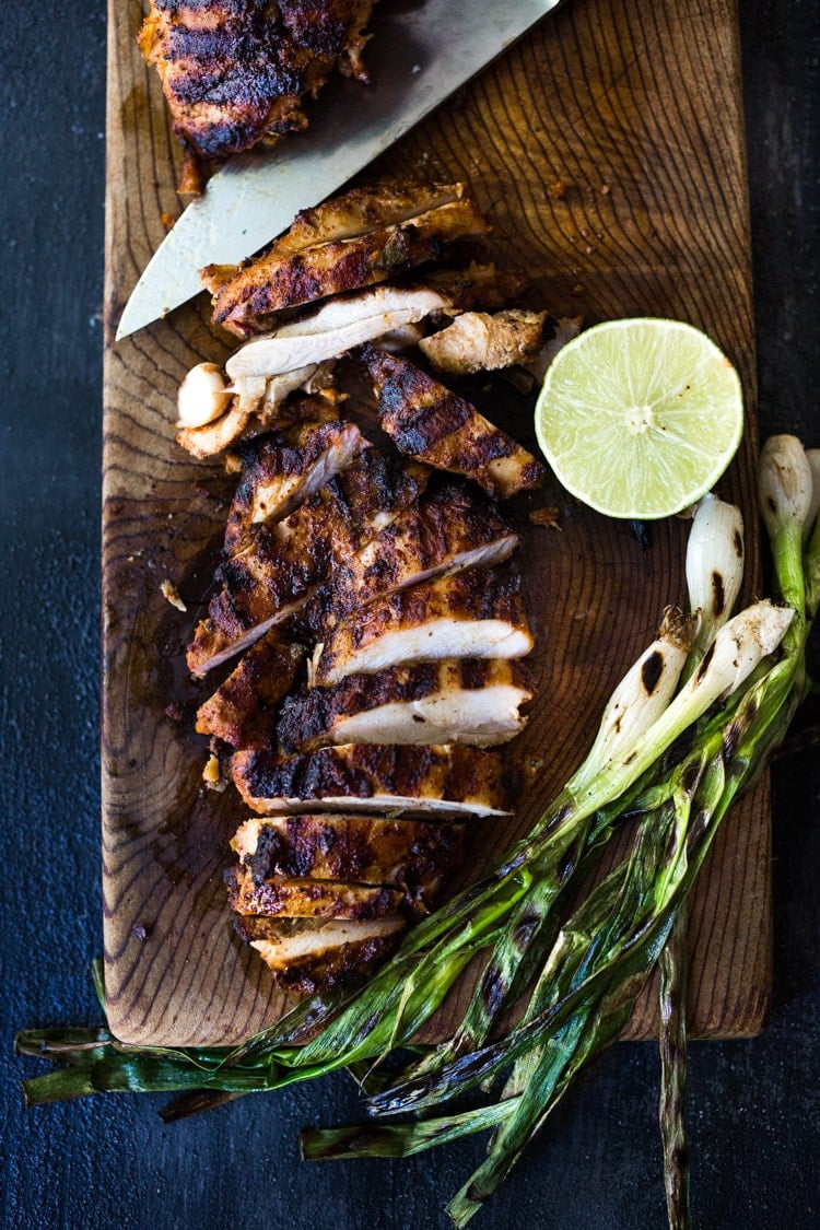 Smoky, spicy and delicious, this Grilled Chipotle Chicken is bathed in the most flavorful marinade. Grill the chipotle chicken ahead and reheat on busy weeknights, or store it in the flavorful chipotle marinade, then fire up the grill after work. Use in burrito bowls, salads, tacos, or pasta. So EASY and oh so tasty! #chipotlechicken #grilledchicken #chicken #chipotle #grilled 