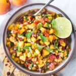 This Fresh Peach Salsa recipe is bursting with summer flavor! Delicious on its own with chips or serve over grilled fish or chicken. Simple and easy, make this when peaches are at their peak of flavor -fresh, juicy and ripe. #peachsalsa #peaches #peach #salsa #peachrecipe #peachsalsarecipe #salsarecipe