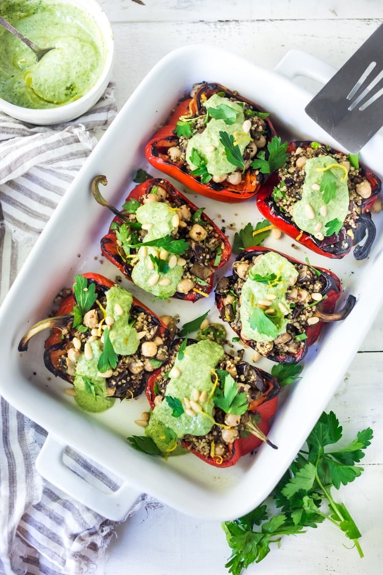 Our Best Quinoa Recipes! Stuffed Peppers with Quinoa, Eggplant and Chickpeas with Zhoug Yogurt. A flavorful vegetarian dinner! #stuffedpeppers #vegetarian #stuffedbellpepper
