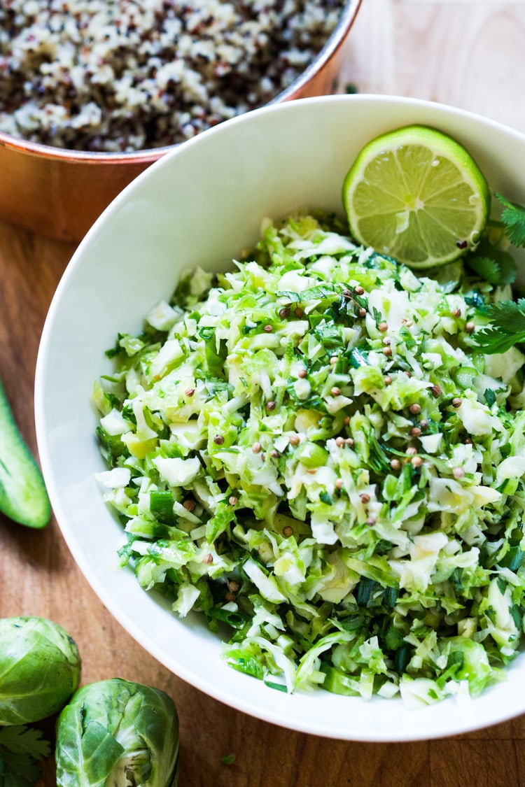 Vegan Mexican Brussel Sprout Salad with jalapeño, lime and cilantro! Serve as a "taco slaw",  a side salad for grill mains or meats. This salad can be made ahead! #brusselsproutsalad #brusslesproutslaw #brusselsprouts #veganslaw #vegansalad #mexicanslaw