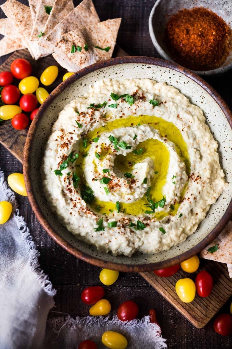 Authentic Baba Ganoush recipe made with smoky grilled eggplant, tahini, garlic and lemon. A healthy, delicious Middle Eastern Eggplant Dip that is full of complexity and depth. Gluten-free, low-carb, vegan. #baba #babaganoush #eggplant #paleo #lowcarb #keto #vegan 