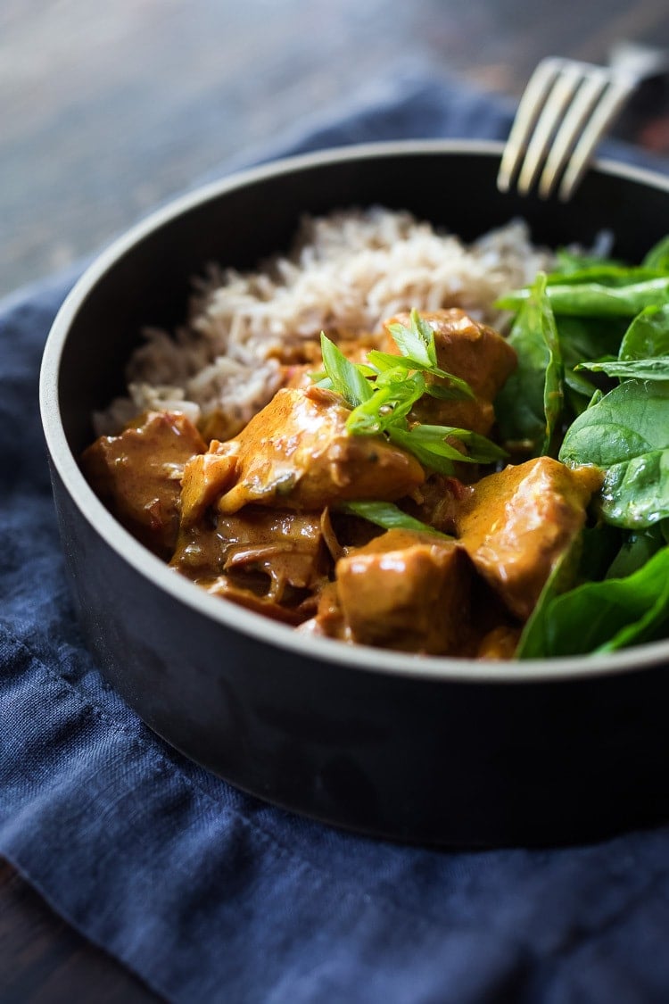 Instant Pot Tikka Masala, made with chicken or kept VEGAN with coconut milk, chickpeas and veggies. Serve over basmati rice, or, for a low-carb, paleo version, serve it over a bowl of baby spinach! #paleo #healthy #tikkamasala #weeknightdinner #instantpottikkamasala #instantpot #chickentikkamasala #vegetariantikkamasala #vegan #instantpotchicken #instantpotchickenrecipes #keto 