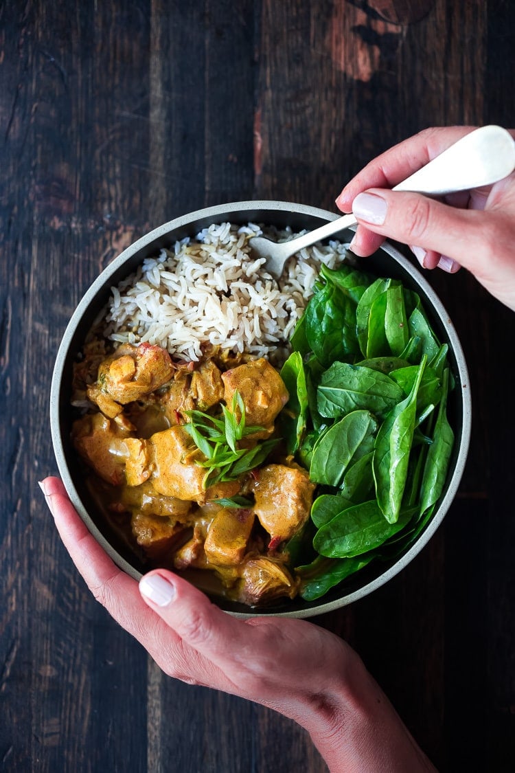 Instant Pot Tikka Masala, made with chicken or kept VEGAN with coconut milk, chickpeas and veggies. Serve over basmati rice, or, for a low-carb, paleo version, serve it over a bowl of baby spinach! #paleo #healthy #tikkamasala #weeknightdinner #instantpottikkamasala #instantpot #chickentikkamasala #vegetariantikkamasala #vegan #instantpotchicken #instantpotchickenrecipes #keto