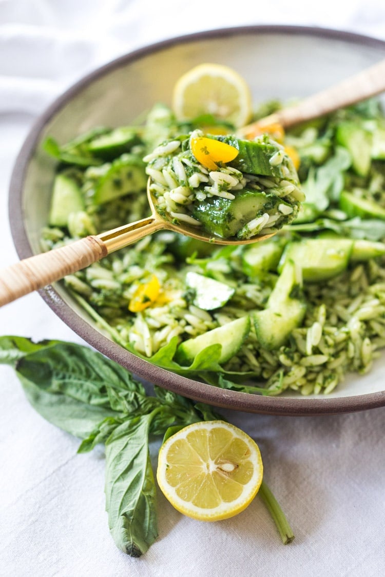 Lemon Basil Orzo Salad with cucumbers, tomatoes and arugula. A healthy, vegan pasta salad that can be made ahead for midweek lunches or potlucks. Keep it vegan or add feta! #orzo #orzosalad #orzopasta #pastasalad #vegan #orzorecipes