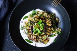Grilled Eggplant Salad with Freekeh, fresh herbs and a tangy yogurt dressing. A delicious Middle Eastern salad that can be made ahead. Vegan adaptable! #freekeh #eggplantsalad