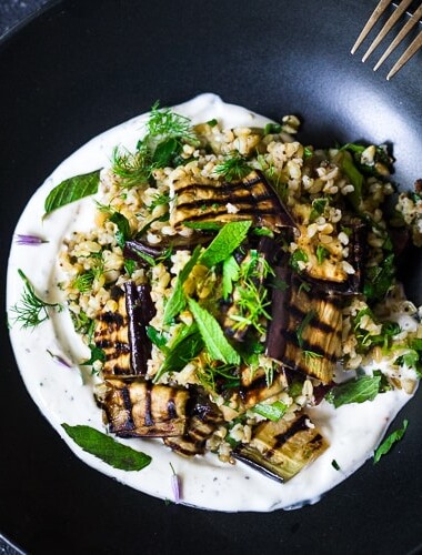 Grilled Eggplant Salad with Freekeh, fresh herbs and a tangy yogurt dressing. A delicious Middle Eastern salad that can be made ahead. Vegan adaptable! #freekeh #eggplantsalad