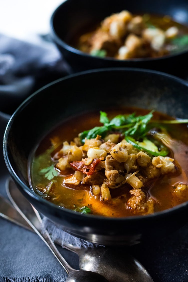 This Chicken Pozole recipe is made with chicken, hominy and red chilies, and can be made in an Instant Pot or on your stovetop. Healthy, delicious, Mexican comfort food, this Pozole Rojo can be made in 30 minutes! Includes a Video. 