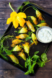 Baked Stuffed Squash Blossoms (Dolmas Style!)with ground lamb, basmati rice and fragrant Middle Eastern spices- a simple delicious main course or appetizer, inspired by the season! #dolmas #squashblossom #zucchiniblossom #squashblossoms #stuffedsquashblossom #baked #keto #paleo #lamb #lambrecipes #groundlamb