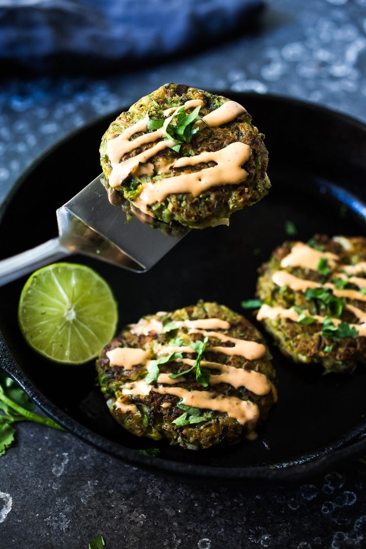 Zucchini Cakes with Jalapeño and Lime, topped with Chipotle Aioli. Serve this with a leafy green salad for a flavorful vegetarian meal! #zucchinifritters #zucchinicakes #zucchinirecipes
