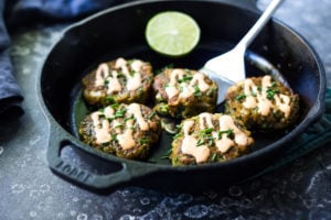 A simple healthy recipe for Zucchini Cakes with Jalapeño and Lime, topped with Chipotle Aioli. Serve this with a leafy green salad for a flavorful vegetarian meal! #zucchinifritters #zucchinicakes #zucchinirecipes