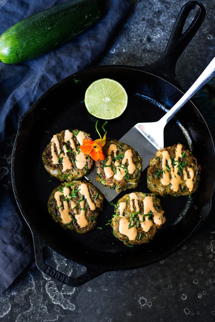 A simple healthy recipe for Zucchini Cakes with Jalapeño and Lime, topped with Chipotle Aioli. Serve this with a leafy green salad for a flavorful vegetarian meal! #zucchinifritters #zucchinicakes #zucchinirecipes