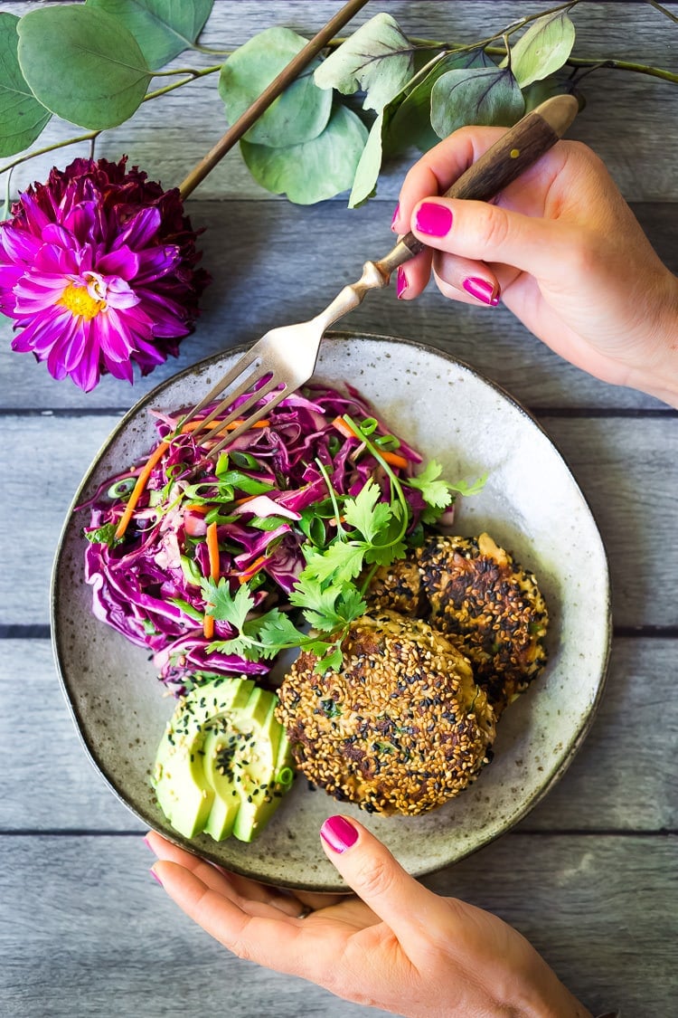 Easy Crunchy Asian Slaw- a simple vegan slaw with the BEST SLAW DRESSING EVER that can be made ahead! Serve this alongside fish, tofu, or chicken or stuffed into tacos, topped onto burgers, or added to buddha bowls. A great way to add more veggies into your everyday meals. #slaw #asianslaw #veganslaw #easyslaw #tacoslaw