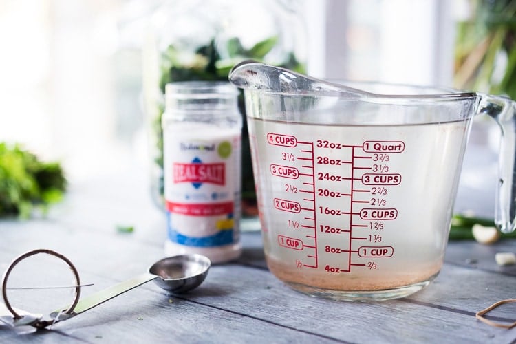 salt and water brine in a large glass measuring cup. 