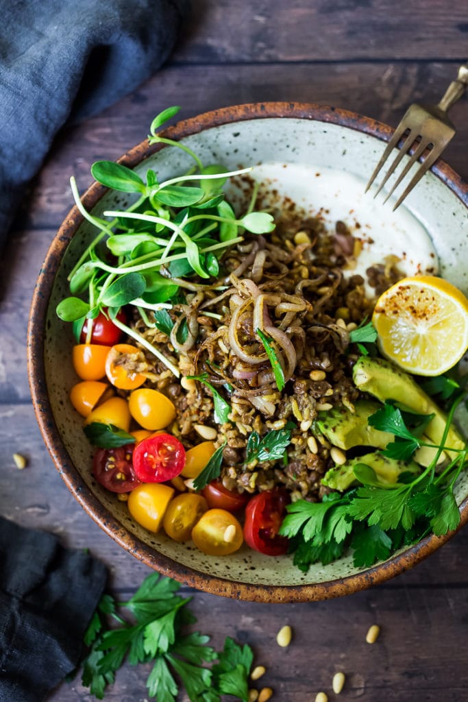 Instant Pot Mujadara - a comforting, healthy vegetarian meal of lentils and rice, with fragrant Middle Eastern spices, served with caramelized shallots, fresh veggies, pine nuts and optional yogurt. Gluten-free and Vegan adaptable. #mujadara #healthy #lentils #rice #instantpot #instapot #mujadararecipe