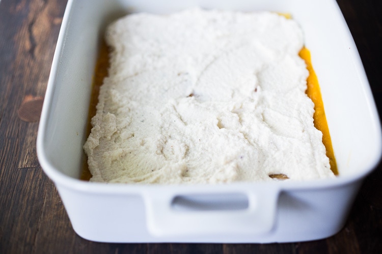 Ricotta cheese being spread. 