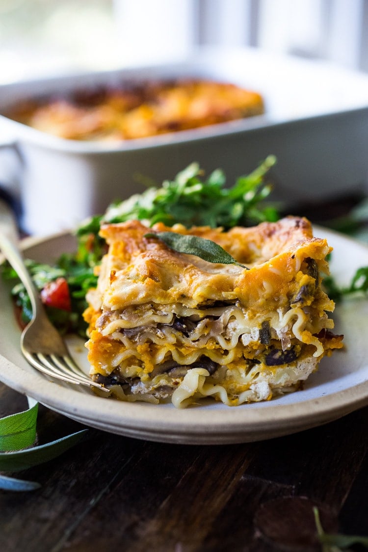 Butternut Lasagna with Wild Mushrooms and Sage- a delicious vegetarian or vegan main dish, perfect for the holiday table! Can be made ahead! #butternutlasagna #veganlasagna #veganthanksgiving #veganmaindish #vegetarianmaindish #mushroomlasaga #veganchristmas #vegandinner #plantbased #cleaneating