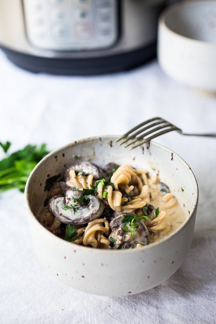 Instant Pot Mushroom Stroganoff - a simple, easy vegetarian weeknight dinner that is creamy, hearty and full of delicious depth and flavor!  Vegan Adaptable! #vegetarian #stroganoff #mushroompasta #veganpasta #instantpotrecipes #instantpot #healthtypasta 