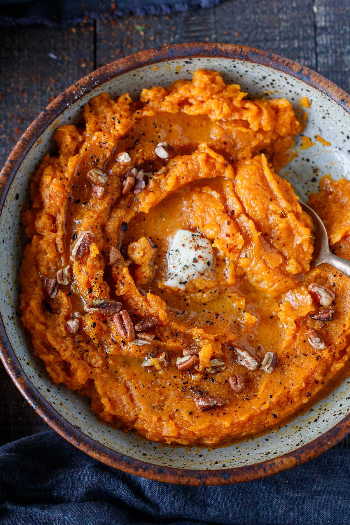 Mashed Sweet Potatoes top with Maple Pecans. Vegan-adaptable and gluten-free.