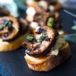 Mushroom Bruschetta with Triple Cream Brie, Sage and Truffle Oil - a surprisingly easy appetizer that tastes amazing and looks elegant! Perfect for holiday gatherings. #mushroombruschetta #mushroomappetizer #appetizer #holidayparty #holidayappetizer