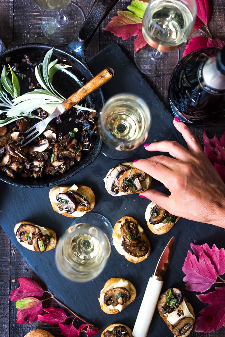 Mushroom Bruschetta with Triple Cream Brie, Sage and Truffle Oil - a surprisingly easy appetizer that tastes amazing and looks elegant! Perfect for holiday gatherings. #mushroombruschetta #mushroomappetizer #appetizer #holidayparty #holidayappetizer #veganbruschetta #glutenfreebruschetta #veganmushroombruschetta #truffleoil #brieappetizer #christmasappetizer 