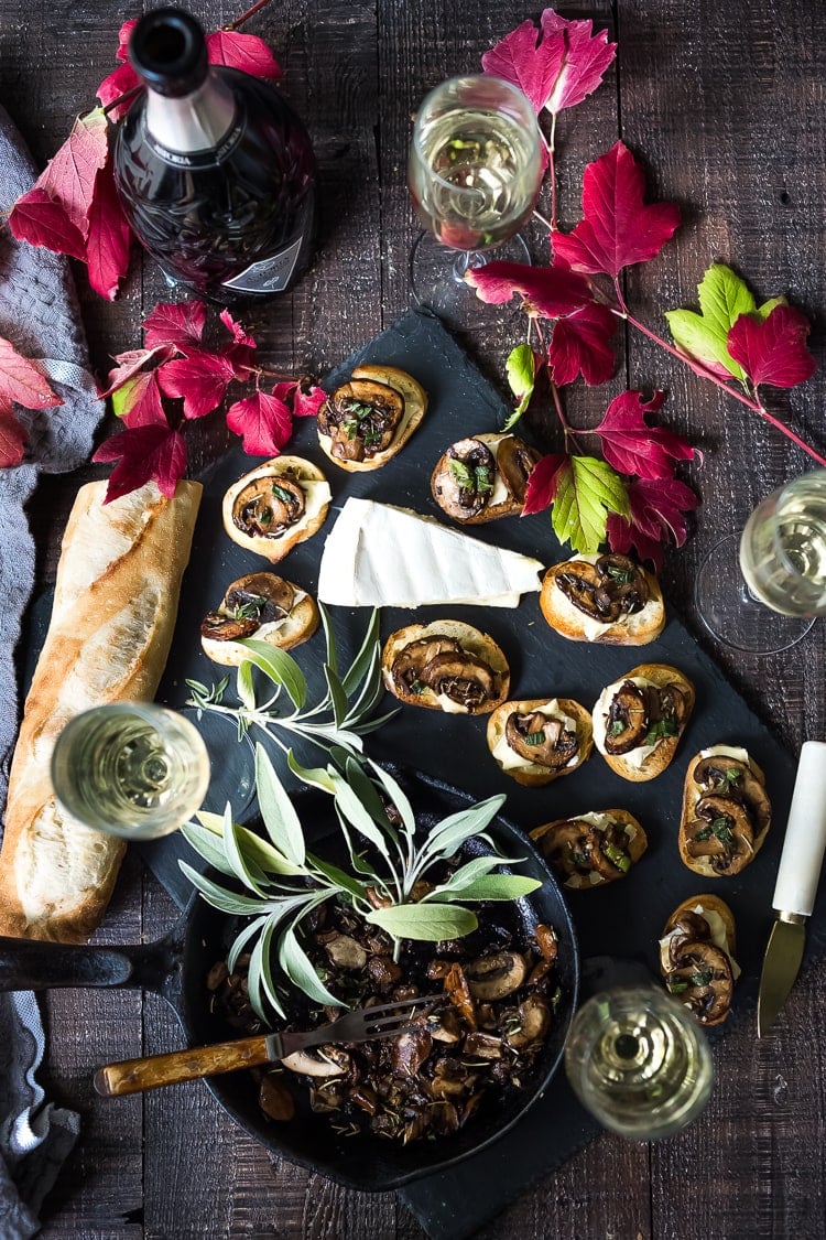 Mushroom Bruschetta with Triple Cream Brie, Sage and Truffle Oil - a surprisingly easy appetizer that tastes amazing and looks elegant! Perfect for holiday gatherings. #mushroombruschetta #mushroomappetizer #appetizer #holidayparty #holidayappetizer 