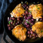 A delicious recipe for Pan-Roasted Chicken with Grapes.  Chicken thighs are pan-seared in a skillet,  then baked in the oven with grapes and shallots. A fast and simple weeknight dinner.