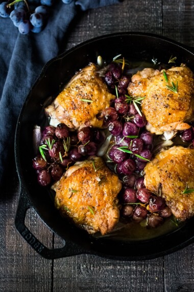 This pan-roasted chicken with grapes is served over our whipped ginger sweet potatoes. A simple, easy, fall-inspired skillet dinner that can be made in 30 minutes! 