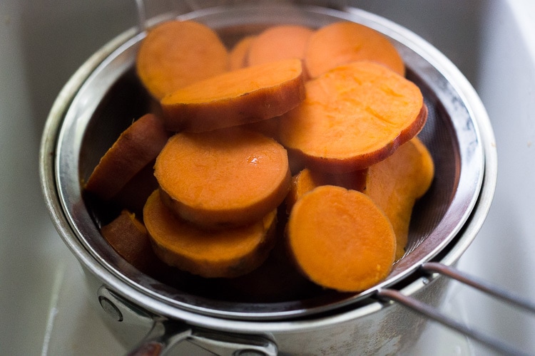 A quick and healthy recipe for Whipped Sweet Potatoes with Ginger - a flavorful vegan side dish that pairs well with fish, chicken or vegan mains. Silky and luscious, these flavorful sweet potatoes can be made in under 30 minutes! #sweetpotatoes #vegan #healthy #mashed 