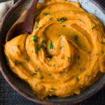 A quick and healthy recipe for Whipped Sweet Potatoes with Ginger - a flavorful vegan side dish that pairs well with fish, chicken or vegan mains. Silky and luscious, these flavorful sweet potatoes can be made in under 30 minutes! #sweetpotatoes #vegan #healthy #mashed