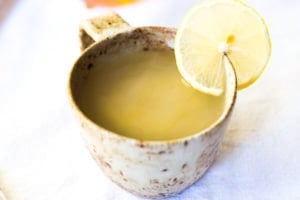 Sore Throat Tea! A homemade tea for sore throat- originating from Morocco, with just three ingredients- lemon, ginger and honey. This healthy, soothing tea remedy is so warming and comforting, you'll want to drink it all winter long! #tea #sorethroatremedy #remedy #tea #gingertea #sorethroattea