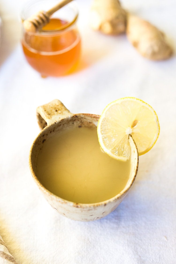 Sore Throat Tea! A homemade tea for sore throat- originating from Morocco, with just three ingredients- lemon, ginger and honey. This healthy, soothing tea remedy is so warming and comforting, you'll want to drink it all winter long! #tea #sorethroatremedy #remedy #tea #gingertea #sorethroattea 