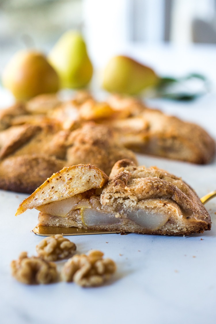  Rustic Pear Galette with Walnut Crust - a cozy fall dessert that is easy to make-  perfect for fall gatherings, holidays and parties. A delicious rustic tart that can be made ahead. #peartart #peardessert #pearrecipes #falldessert #dessert 