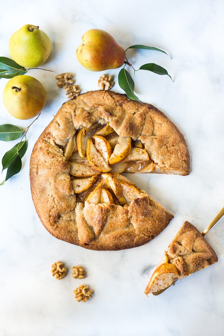 rustic pear galette with slice removed.