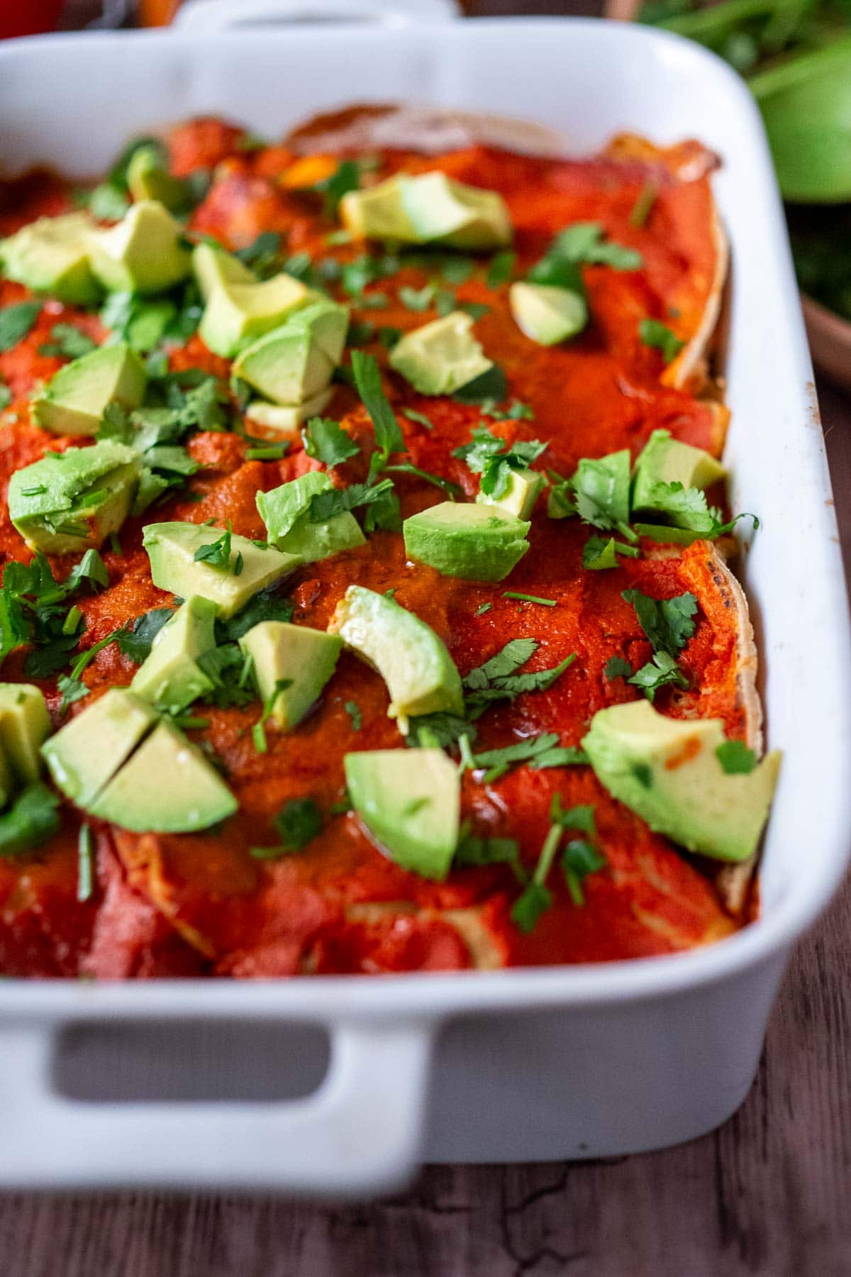 A fast and easy recipe for Enchilada Casserole, with black beans, corn, sweet potatoes and a quick 5 Minute Enchilada Sauce. Comforting and healthy! Keep it vegetarian or add cooked chicken or ground turkey!