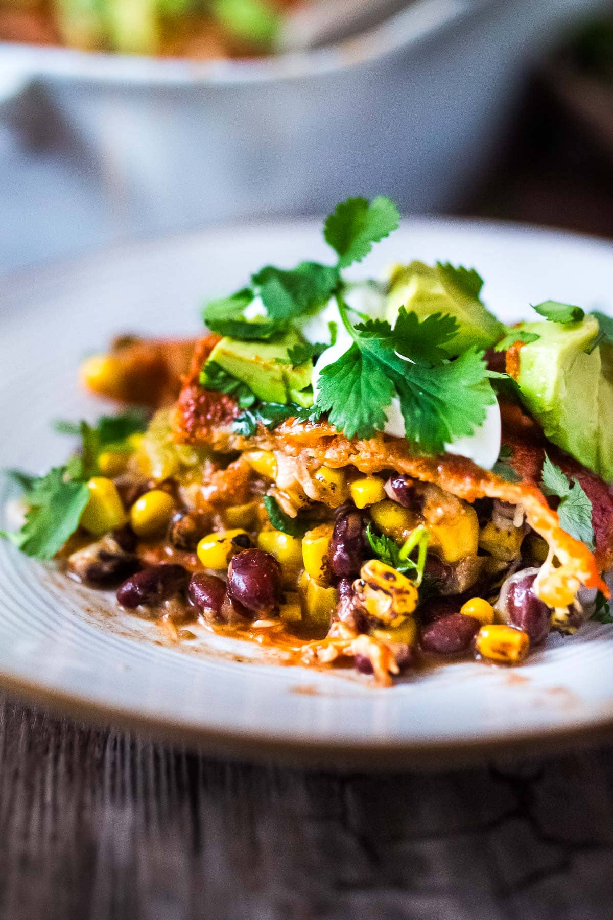 A fast and easy recipe for Enchilada Casserole, with black beans, corn, sweet potatoes and a quick 5 Minute Enchilada Sauce. Comforting and healthy! Keep it vegetarian or add cooked chicken or ground turkey!