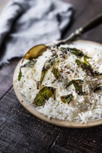 How to cook fluffy, perfectly cooked Basmati Rice, just like they do in India! Finished with an optional- tempering oil this rice is nothing short of delicious! Fast, easy and vegan-adaptable.