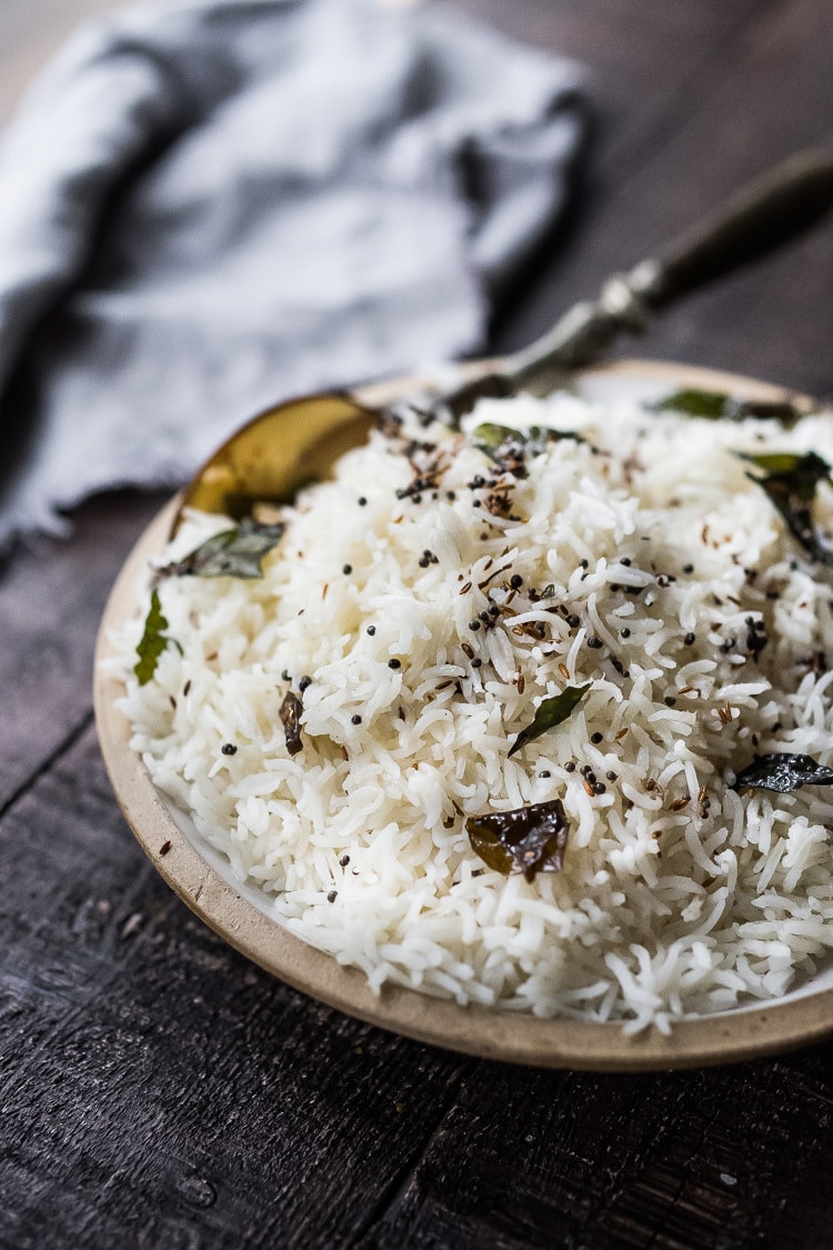 How to cook fluffy, perfectly cooked Basmati Rice, just like they do in India! Finished with an optional- tempering oil this rice is nothing short of delicious! Fast, easy and vegan-adaptable.