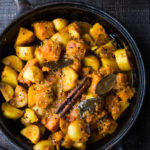 North Indian Butternut and Potato Curry, served over fluffy Basmati Rice. Subtle flavor, soothing and comforting. | #indiancurry #vegetarian #butternut #aloo #rajisthanifood #potatocurry #currypotaotes